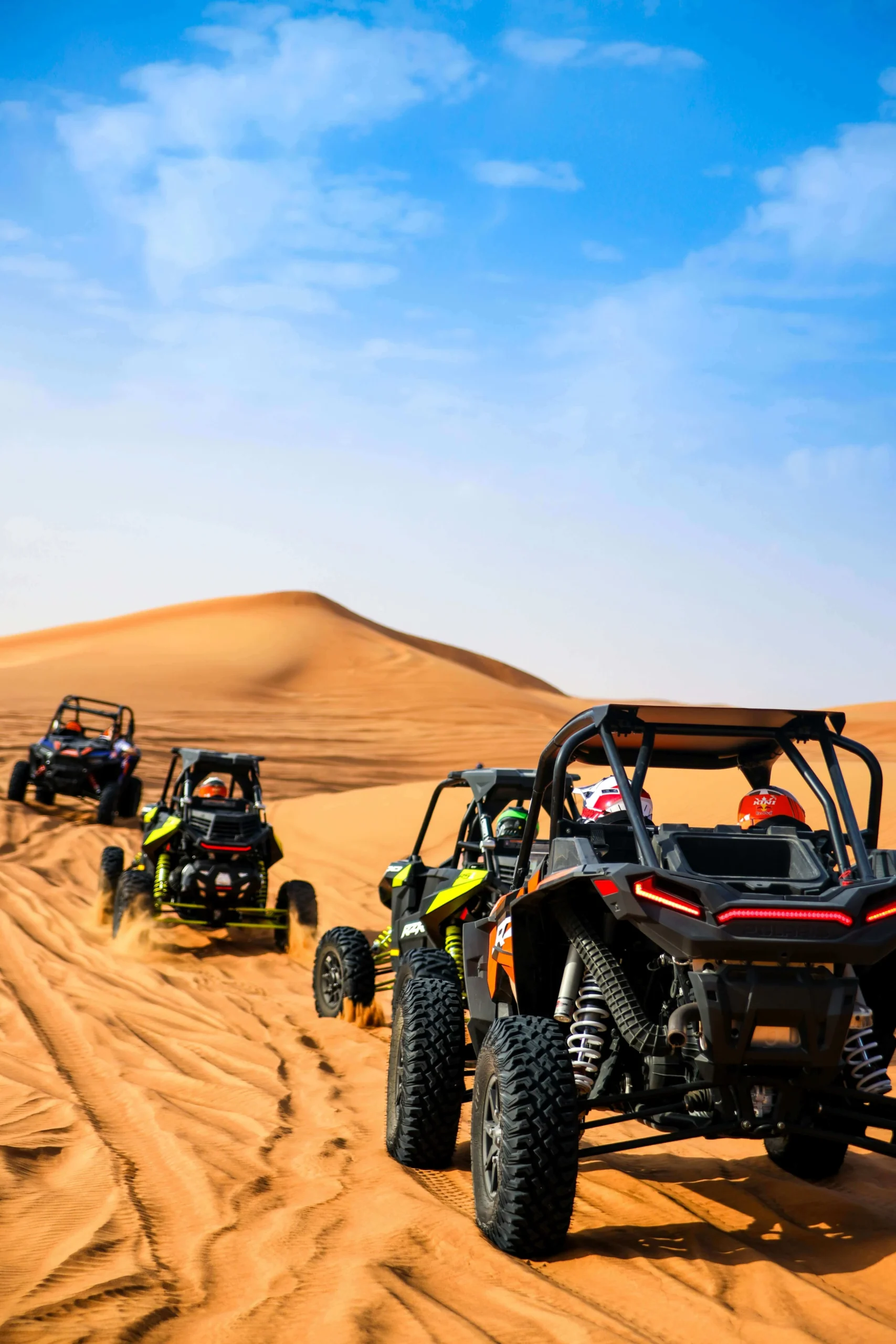 Private luxury desert camp nestled among the golden sand dunes of Merzouga, Morocco at sunset .7 Days Tour from Marrakech