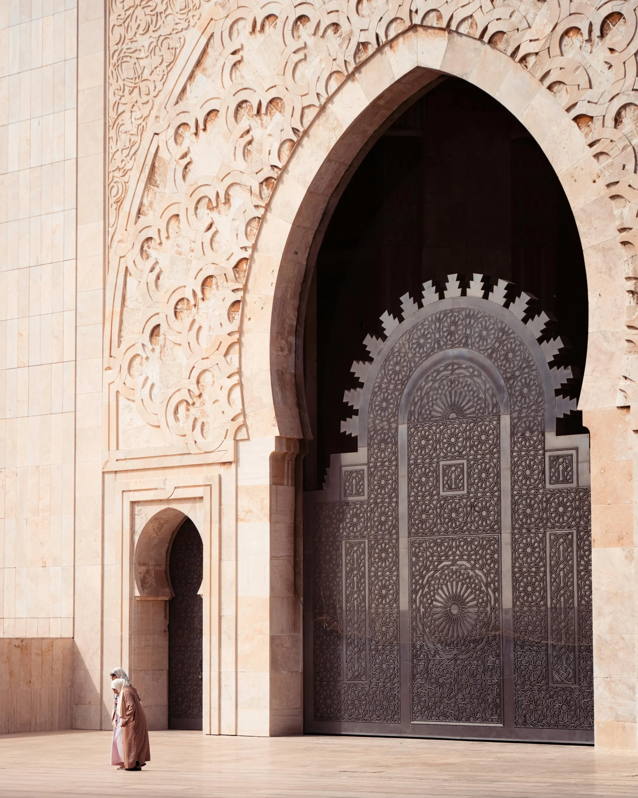 Intricate Moroccan mosaics and marble columns inside the Hassan II Mosque in Casablanca morocco desert tours from casablanca